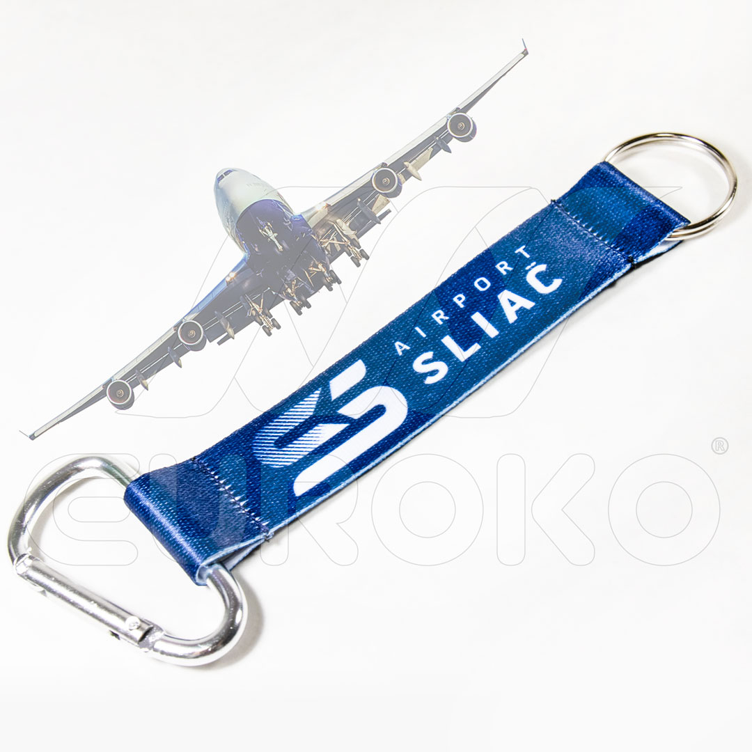 Dubbel bevestigingssysteem met sleutelring en karabijnhaak.