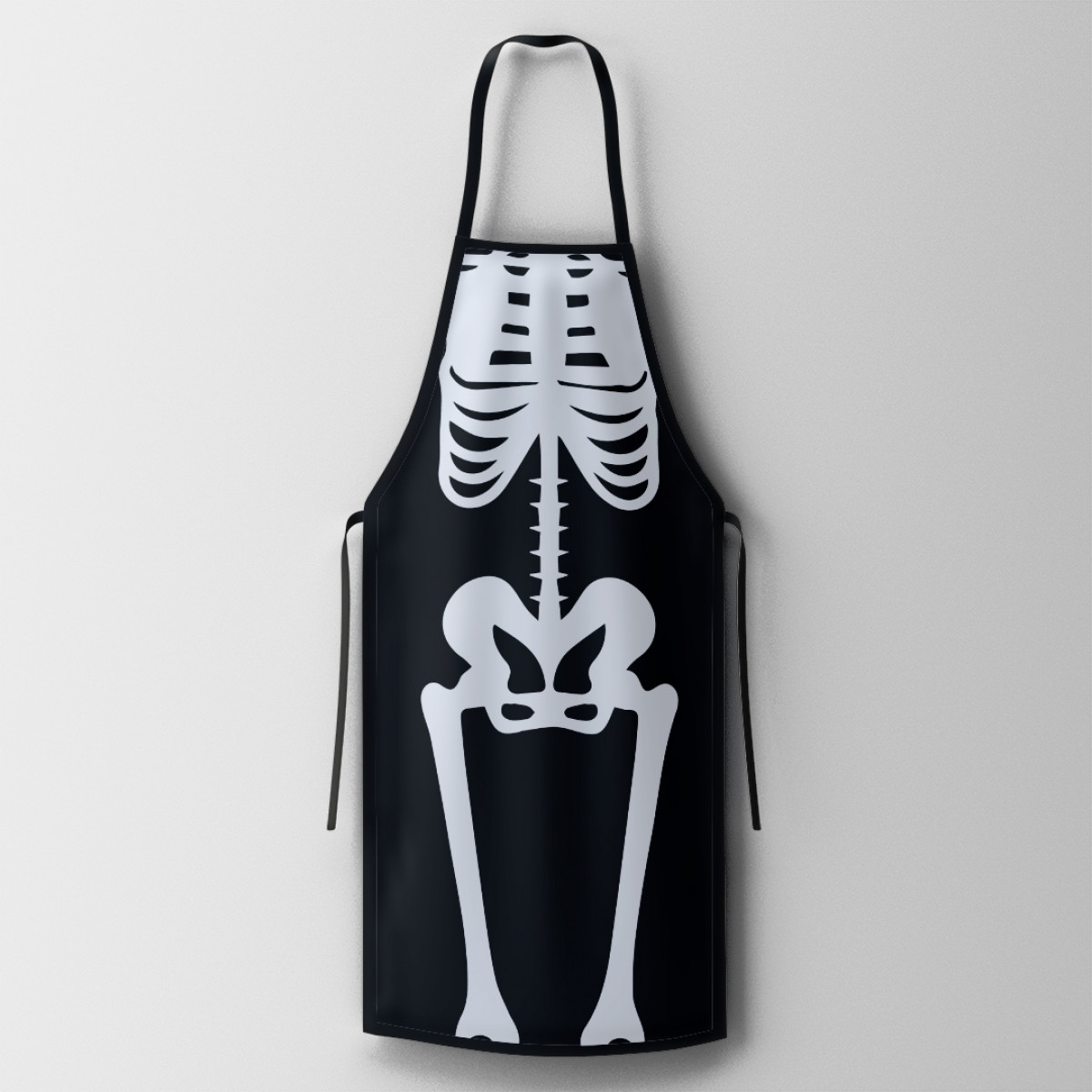 Maak indruk met het opvallende skeletdesign op dit unieke schort.