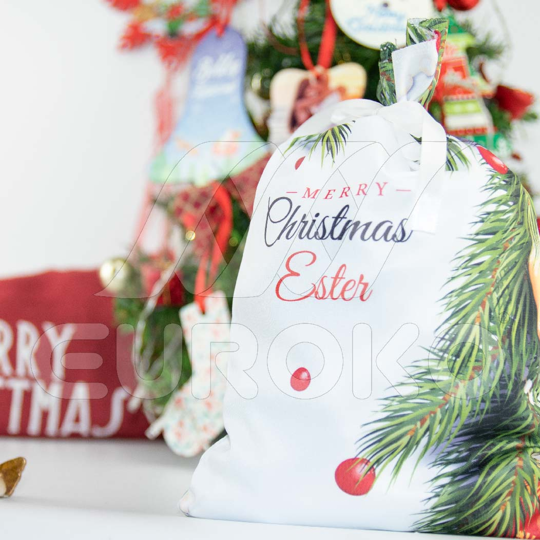 Veelzijdige kerstzak met decoratief lint voor elk cadeau.